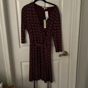 This is a NWT burgundy with print classic wrap dress.